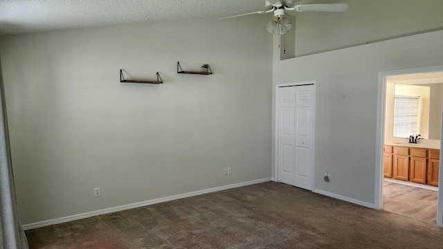 full bathroom with vanity, shower / bath combo, and toilet