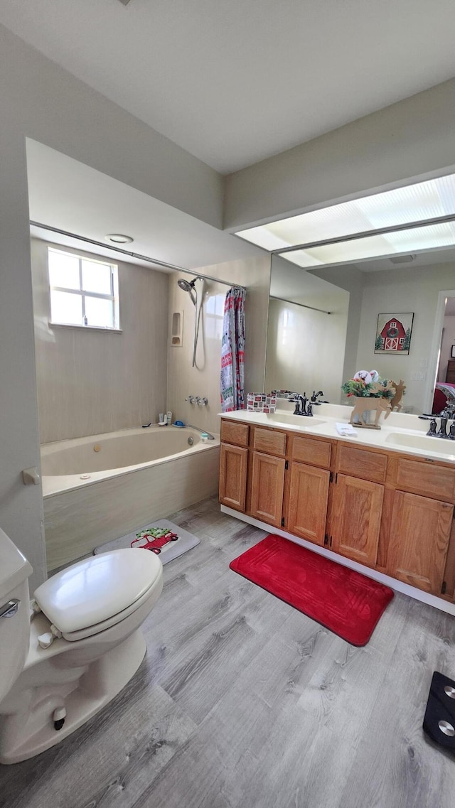 full bathroom with vanity, wood-type flooring, toilet, and shower / bath combo