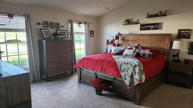 carpeted bedroom featuring vaulted ceiling and a textured ceiling