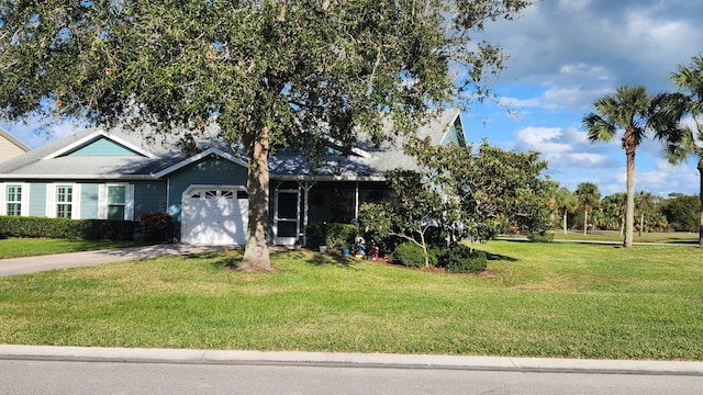 view of front of house with a garage and a front lawn