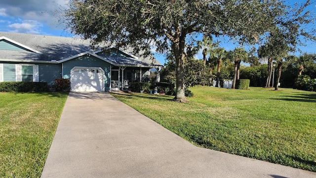 view of front facade featuring a garage and a front yard