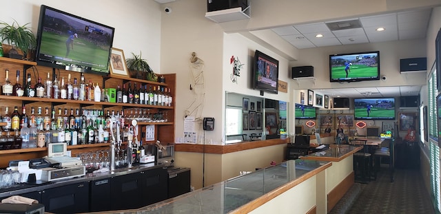 bar with a paneled ceiling