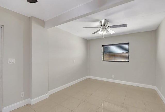 tiled empty room featuring ceiling fan