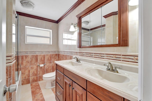 bathroom featuring vanity, toilet, tile walls, and ornamental molding