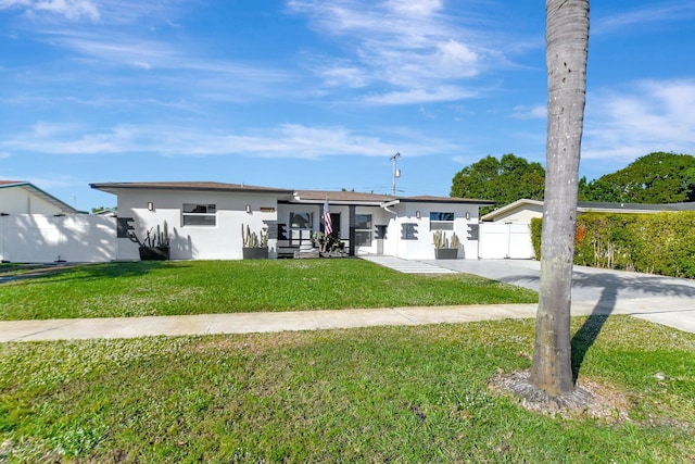 ranch-style home with a front yard