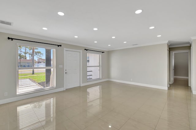 empty room with light tile patterned flooring and ornamental molding