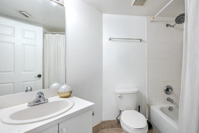 full bathroom with tile patterned floors, vanity, toilet, and shower / tub combo