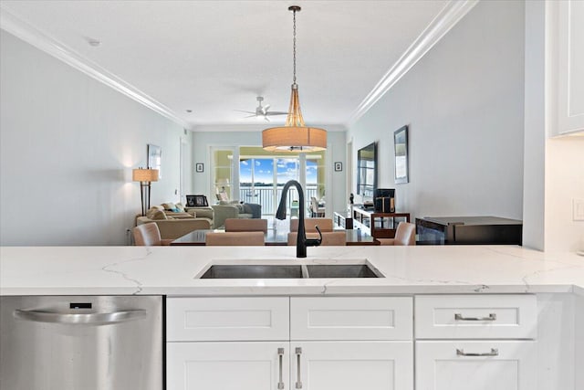 kitchen featuring light stone countertops, dishwasher, sink, decorative light fixtures, and white cabinets