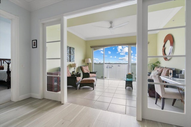 sunroom featuring ceiling fan