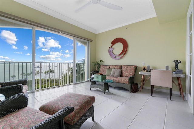 sunroom / solarium with ceiling fan and a water view