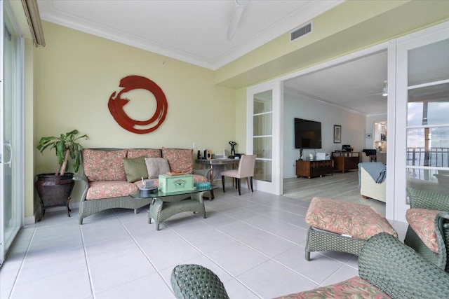 living room featuring light tile patterned floors and ornamental molding