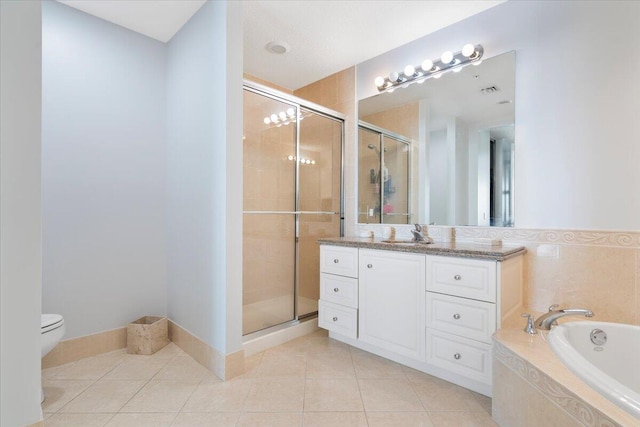 full bathroom featuring tile patterned flooring, vanity, separate shower and tub, and toilet