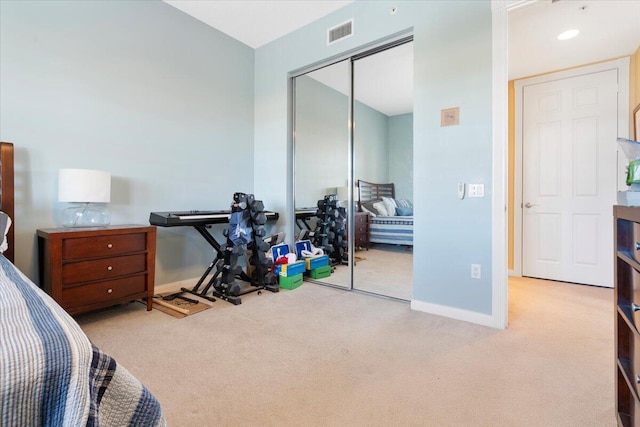 carpeted bedroom featuring a closet