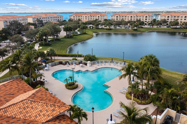 view of pool featuring a water view