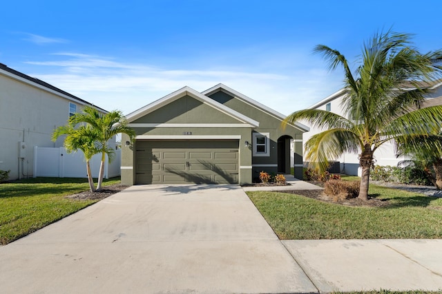 view of front of home featuring a garage and a front yard