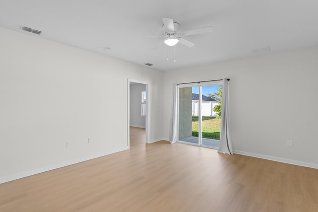 spare room featuring ceiling fan and light wood-type flooring