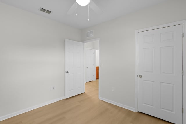 unfurnished bedroom featuring ceiling fan and light hardwood / wood-style flooring