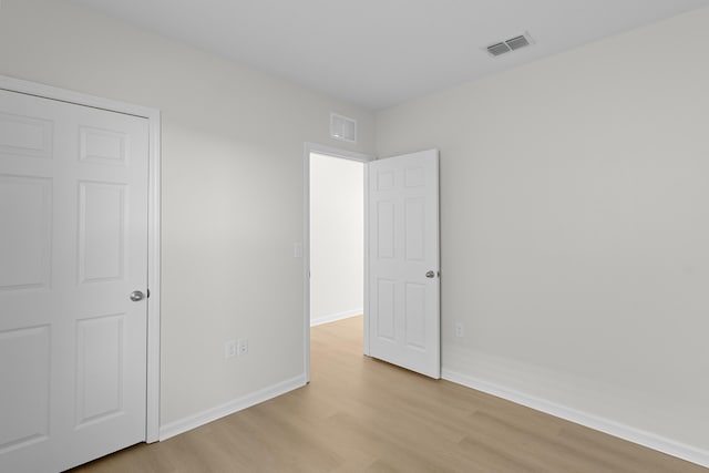 unfurnished bedroom featuring light wood-type flooring