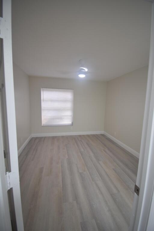 unfurnished room featuring light hardwood / wood-style flooring