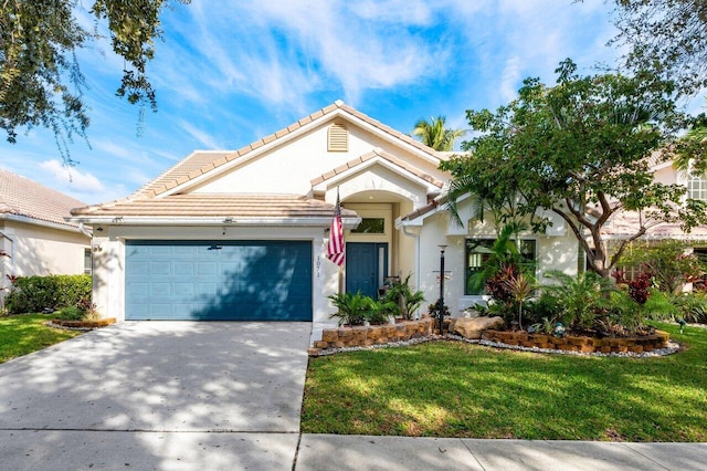 view of front of house with a front yard and a garage