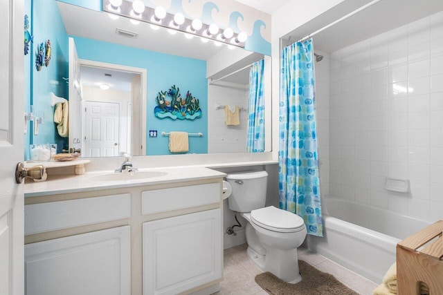 full bathroom featuring tile patterned flooring, vanity, toilet, and shower / bathtub combination with curtain