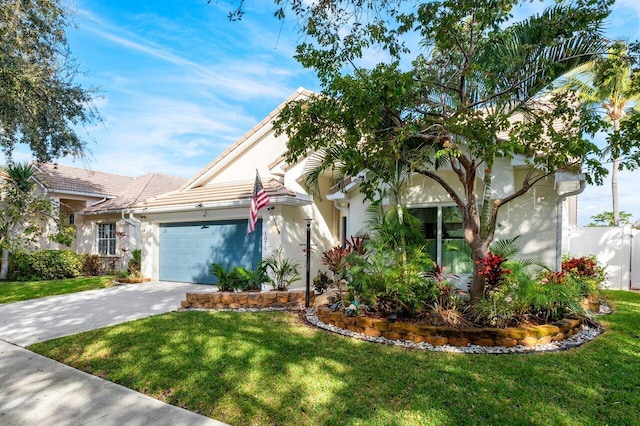 view of front facade featuring a garage and a front lawn