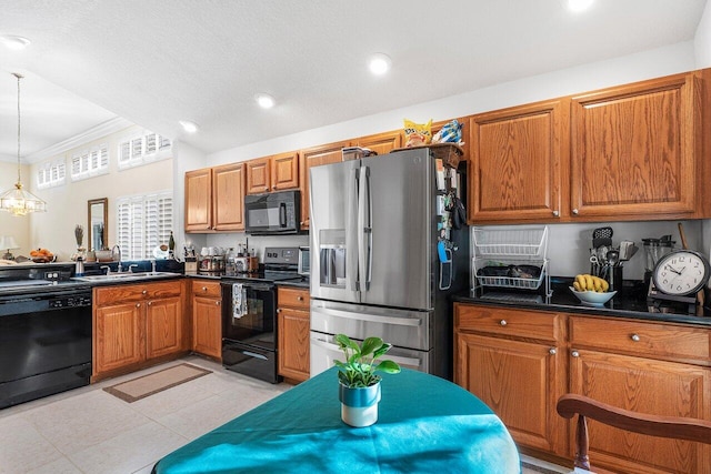 kitchen with hanging light fixtures, crown molding, sink, and black appliances