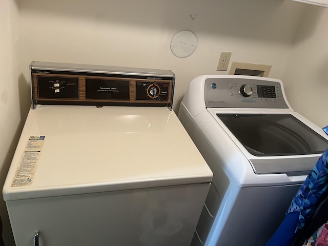 laundry room with separate washer and dryer