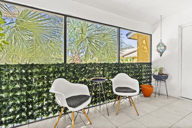 living area with tile patterned floors