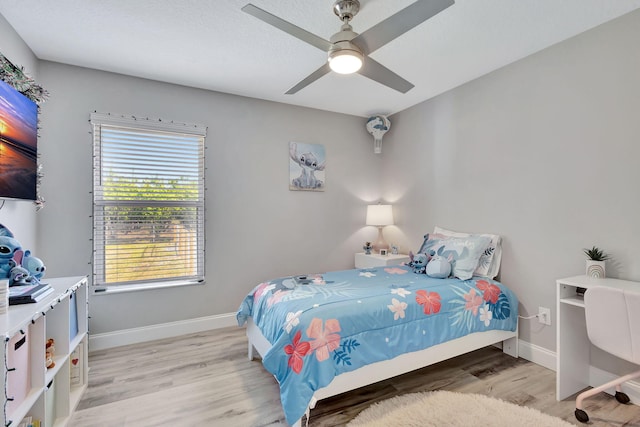 bedroom featuring ceiling fan and light wood-type flooring