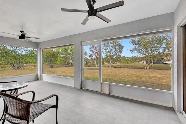 sunroom / solarium with ceiling fan