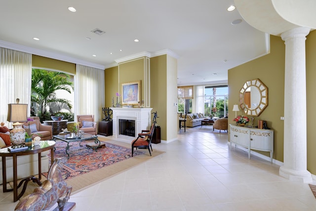 tiled living room with ornamental molding and decorative columns