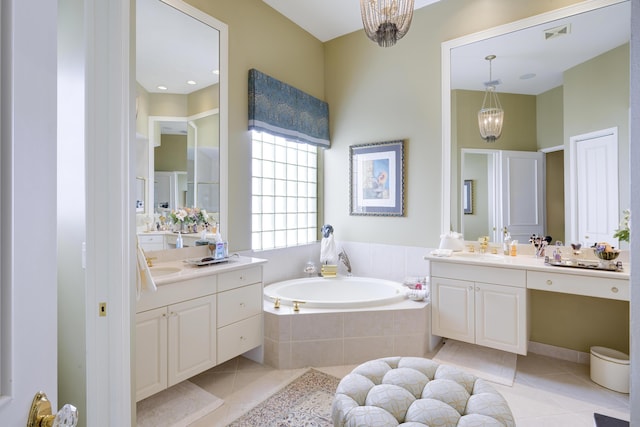 bathroom featuring vanity, a notable chandelier, and tile patterned floors