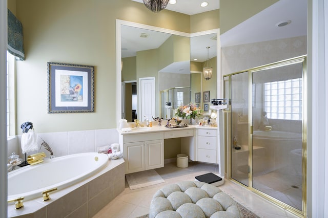 bathroom with vanity, separate shower and tub, a healthy amount of sunlight, and tile patterned floors