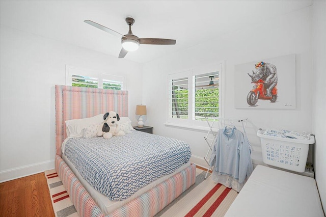 bedroom with ceiling fan and light wood-type flooring