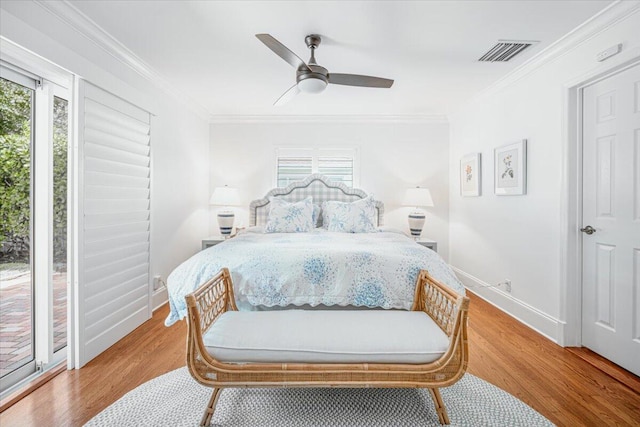 bedroom featuring ceiling fan, access to exterior, light wood-type flooring, and ornamental molding