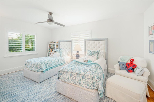 bedroom with hardwood / wood-style floors and ceiling fan