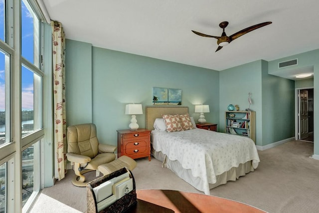 carpeted bedroom with access to outside and ceiling fan