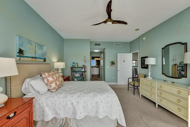 carpeted bedroom featuring multiple windows and ceiling fan