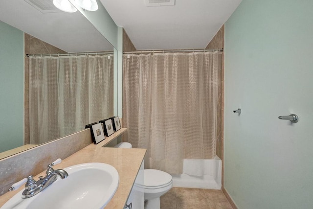 full bathroom featuring tile patterned flooring, shower / bath combination with curtain, vanity, and toilet