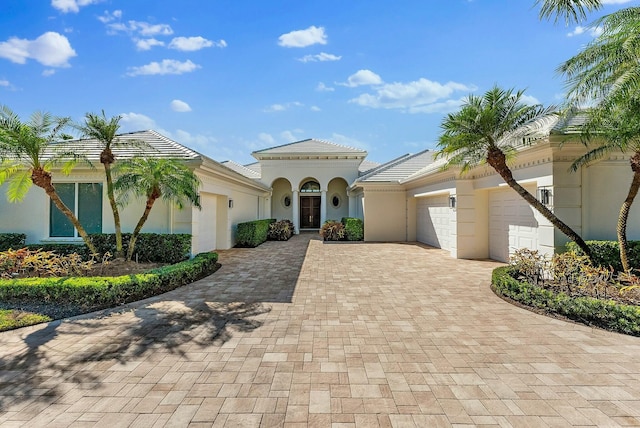 mediterranean / spanish-style home featuring a garage