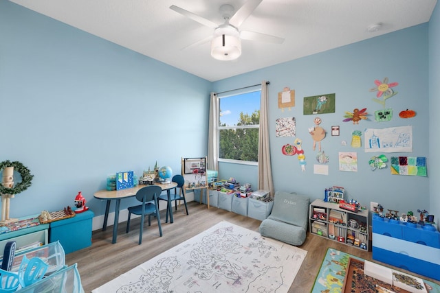 playroom featuring ceiling fan and wood finished floors