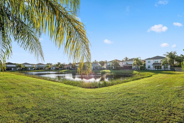 exterior space with a water view and a residential view