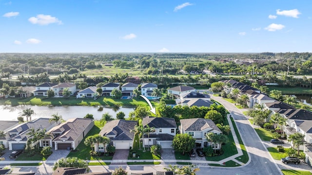 bird's eye view with a water view and a residential view