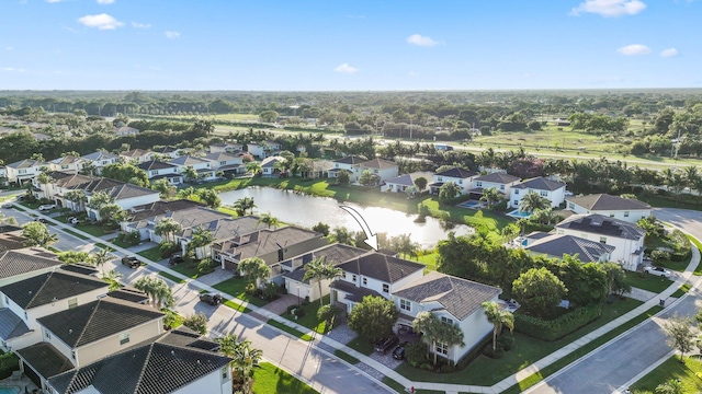 birds eye view of property featuring a residential view and a water view