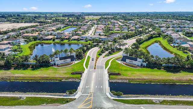 bird's eye view featuring a water view and a residential view