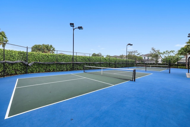 view of tennis court with basketball court