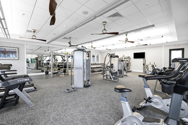 gym featuring visible vents, ceiling fan, and baseboards