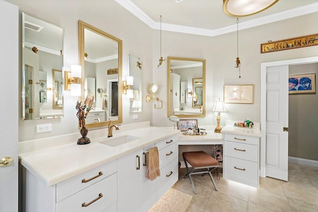 bathroom featuring tile patterned flooring, vanity, and crown molding