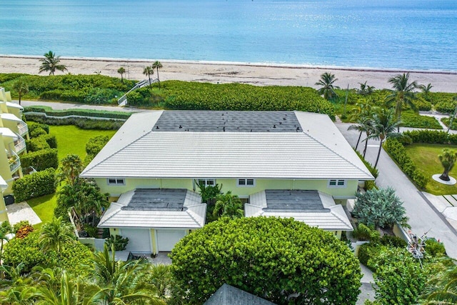 bird's eye view featuring a water view and a beach view